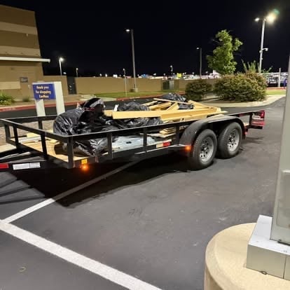 Mako equipment and utility trailer loaded and ready for an after-hours job in a parking lot